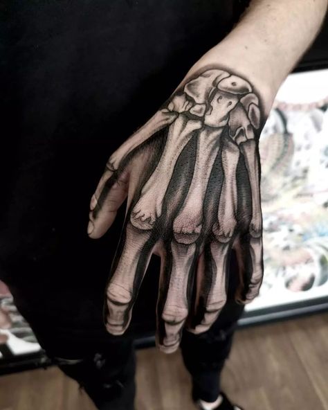 21 Coolest Skeleton Hand Tattoo Ideas