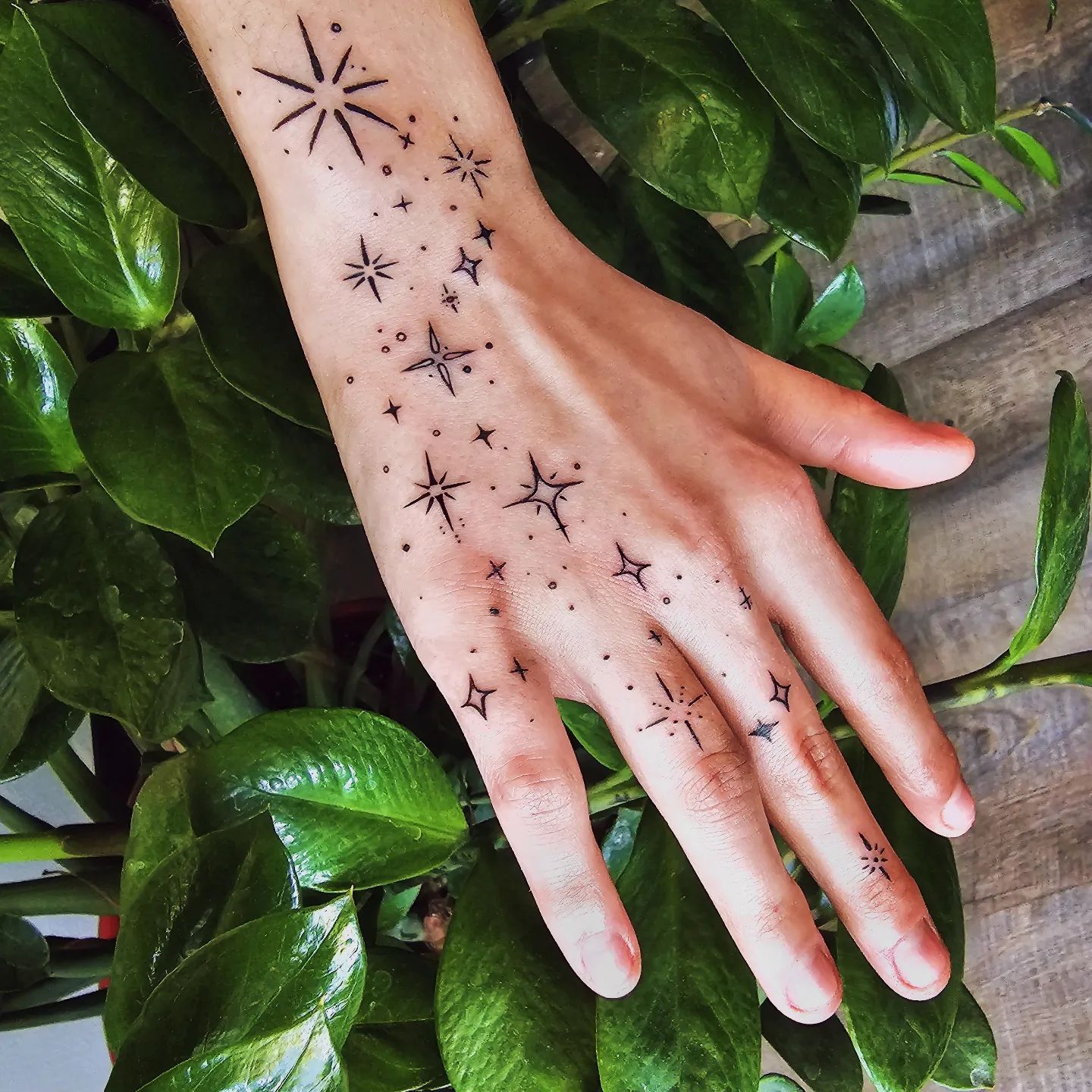 Celestial Hand Tattoo Design