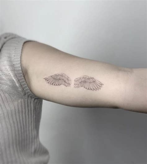 Micro Realistic Wings Tattoo On The Inner Arm Micro Realistic Wings Tattoo On The Inner Arm
