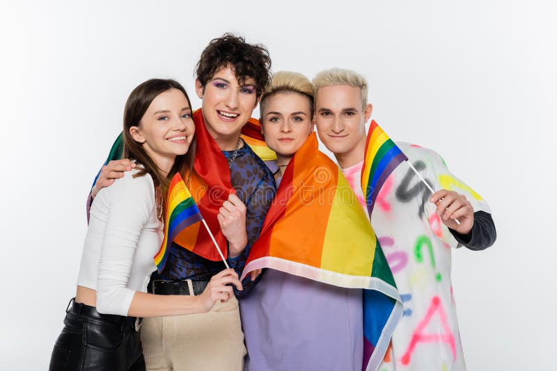 Selective Focus Of Smiling Lesbian Couple With Rainbow Flags Looking At Camera Lgbtq Community